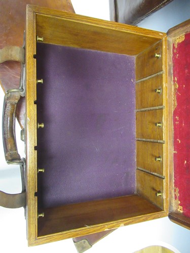Lot 101 - A Lang & Hussey leather and oak cartridge box...