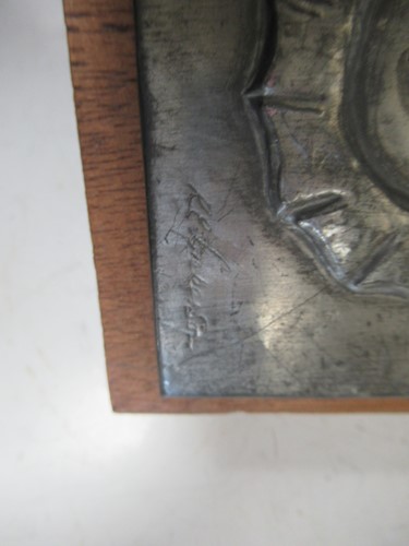 Lot 96 - An embossed metal sheet with seahorse relief...