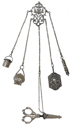 Lot 424 - An early 20th century silver 5 chain chatelaine with attachments