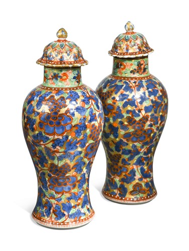 Lot 470 - A pair of Chinese blue and white porcelain 'clobbered' vases, 18th century