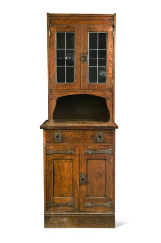 Lot 160 - Liberty & Co., an Arts & Crafts oak narrow bookcase cabinet