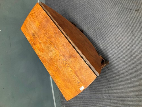 Lot 386 - An oak gateleg table with oval drop flap top,...
