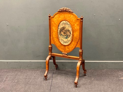Lot 507 - A satinwood adjustable firescreen with silk...