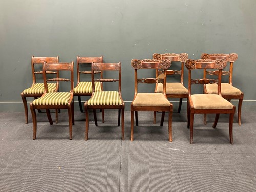 Lot 457 - Two sets of four Regency mahogany sabre leg...