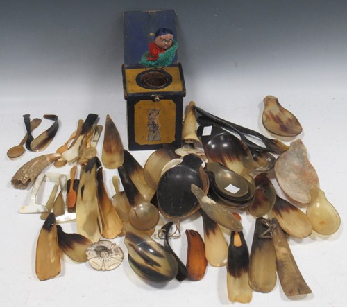 Lot 124 - A collection of horn shoe horns, spoons and...
