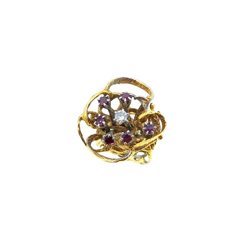 Lot 139 - A late 20th century 18ct gold ruby and diamond cocktail dress ring