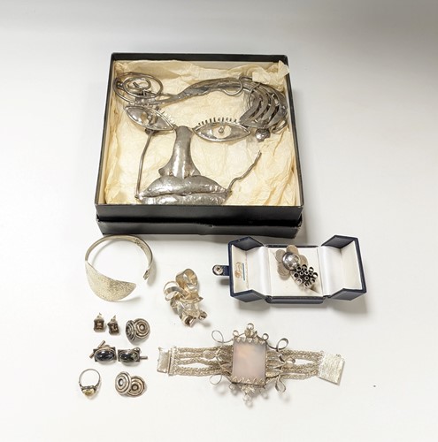 Lot 192 - Three silver rings, a silver bangle and a...