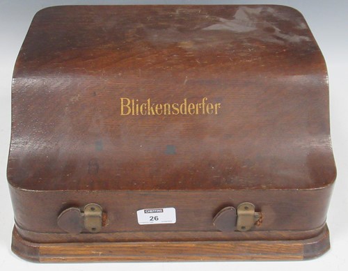 Lot 26 - A Blickensderfer oak cased vintage typewriter,...
