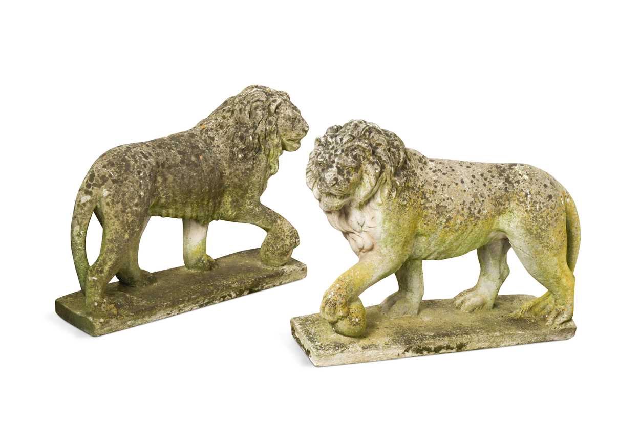 Lot 624 - An opposing pair of composite stone Medici lions, 20th century