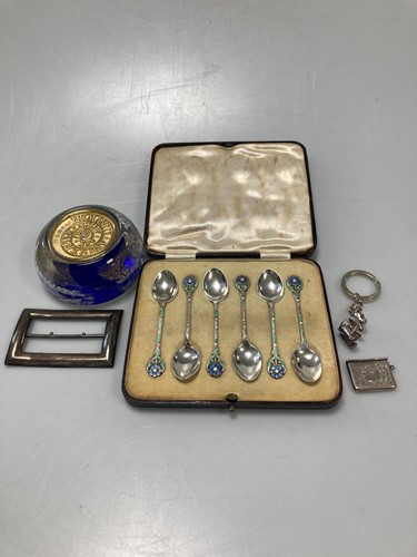 Lot 202 - A coloured glass paperweight inlaid with fine...
