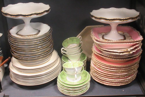 Lot 98 - A floral-painted dessert service with a pink...