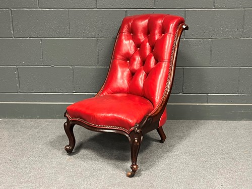 Lot 760 - A Victorian low fire-side chair or chauffeuse,...