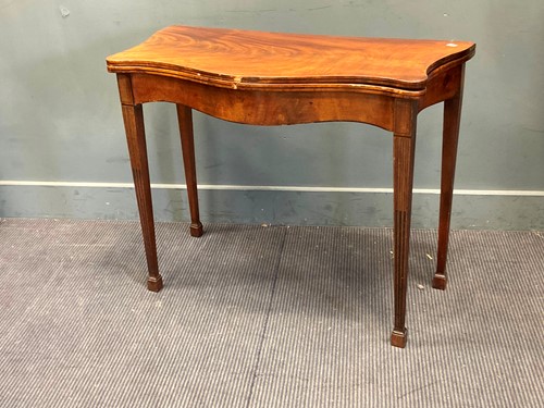 Lot 377 - A George III mahogany serpentine foldover top...