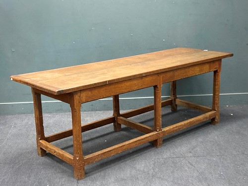Lot 448 - An oak refectory table on six chamfered legs...