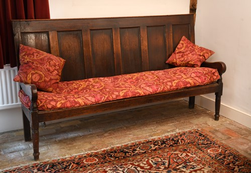 Lot 420 - An oak panel back settle, early 19th century