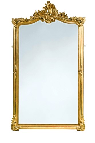 Lot 738 - A Victorian rococo style gilt framed wall mirror