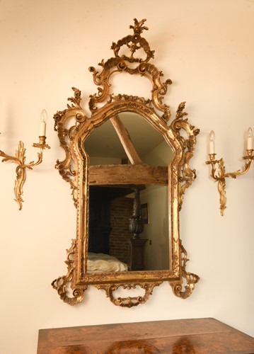 Lot 423 - A Rococo style carved giltwood wall mirror, 19th century