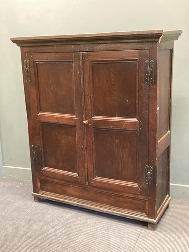 Lot 382 - An oak panelled two door hanging cupboard, 165...