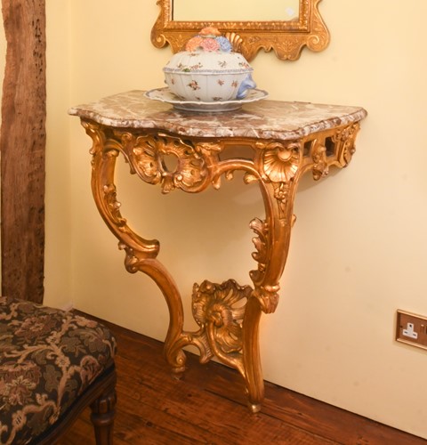 Lot 426 - A Rococo style carved giltwood console table, 19th century