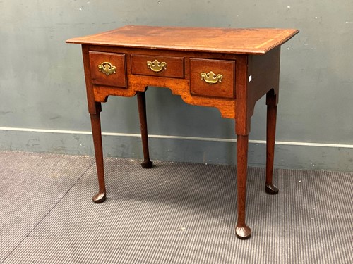 Lot 783 - An 18th century oak and elm lowboy 76 x 85.5 x...