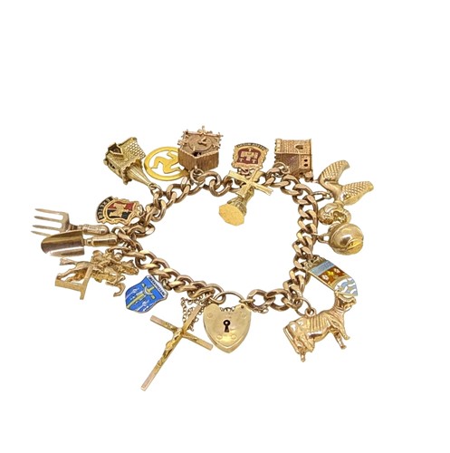 Lot 54 - A 9ct gold charm bracelet