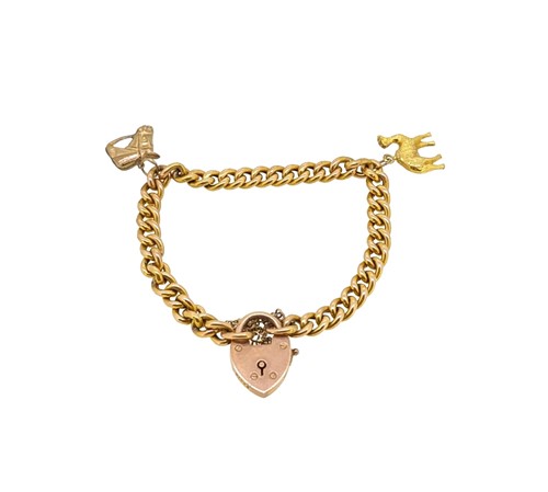 Lot 63 - A charm bracelet