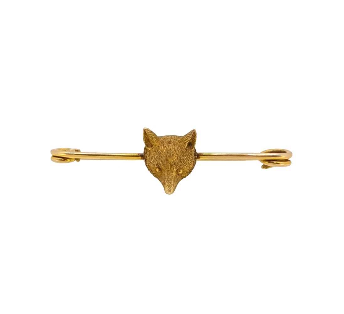 Lot 39 - A fox head stock pin brooch,