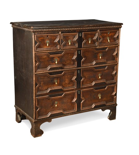 Lot 351 - A geometric moulded chest of drawers, 18th century