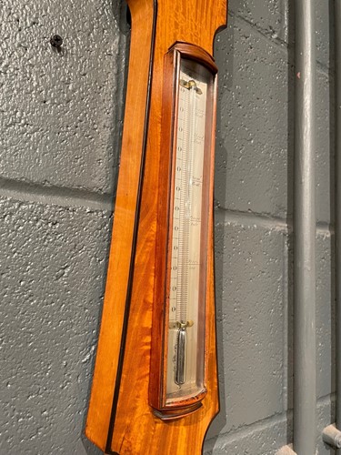 Lot 564 - A satinwood banjo barometer by Dixey, London, of narrow proportions, 19th century