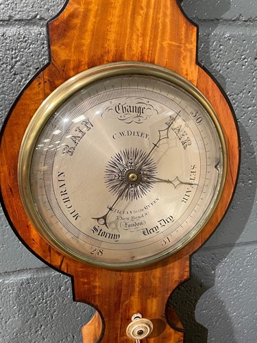 Lot 564 - A satinwood banjo barometer by Dixey, London, of narrow proportions, 19th century