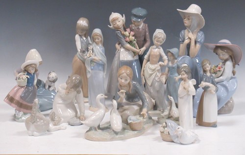 Lot 9 - A collection of twelve Lladro figures, two Nao...