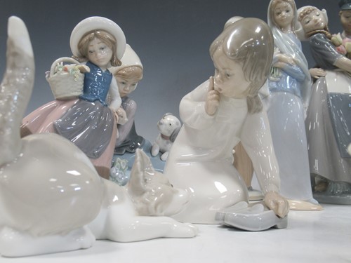 Lot 9 - A collection of twelve Lladro figures, two Nao...