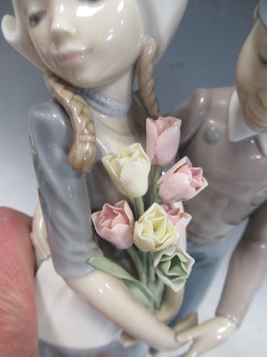 Lot 9 - A collection of twelve Lladro figures, two Nao...