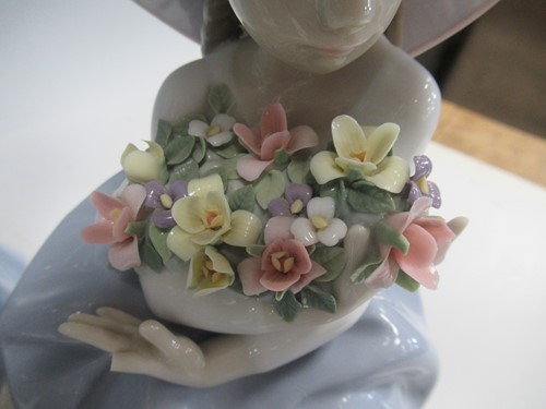 Lot 9 - A collection of twelve Lladro figures, two Nao...