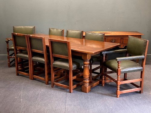 Lot 483 - A reproduction oak dining room suite,...