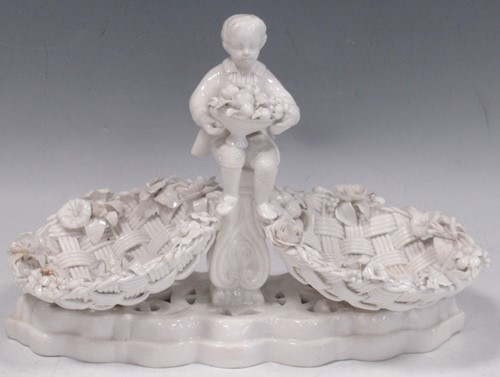 Lot 57 - A Meissen figural basket, mounted with a young...