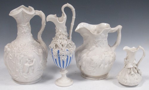 Lot 20 - Four Copeland parian jugs, moulded and applied...