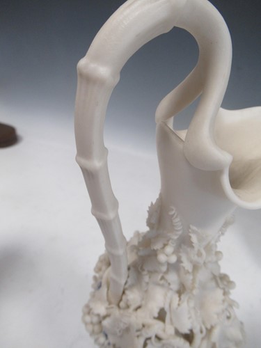 Lot 20 - Four Copeland parian jugs, moulded and applied...