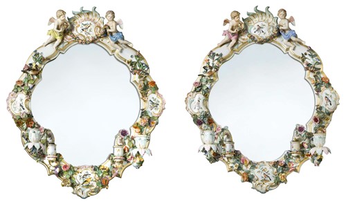 Lot 575 - A pair of Meissen two branch girandoles