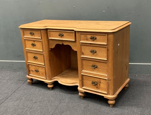 Lot 442 - A Victorian stripped pine kneehole dressing...