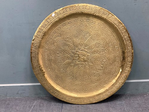 Lot 491 - An Indian polished circular brass tray, 89cm...