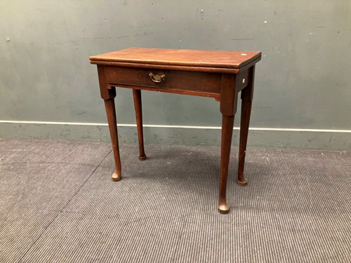 Lot 469 - A George III mahogany fold-over top tea table...