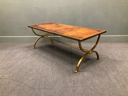 Lot 515 - A leather topped brass X-frame coffee table,...