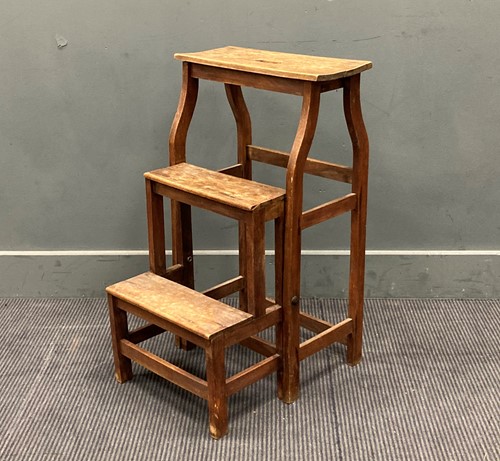 Lot 511 - A 20th century beech set of folding library...