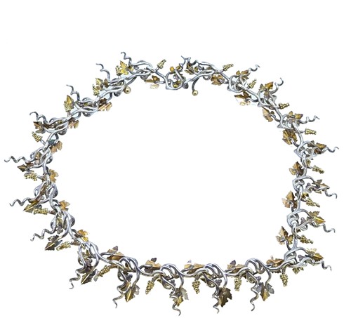 Lot 10 - Brett Payne - An 18ct gold and silver grape vine and corkscrew necklace