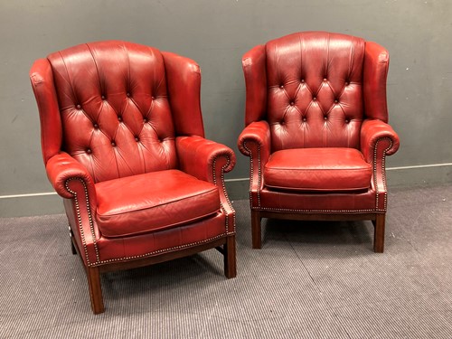 Lot 512 - A pair of leather wingback armchairs, 110 x 82...