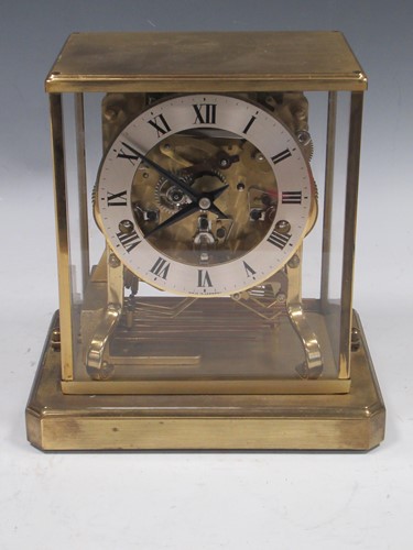 Lot 104 - A brass skeleton clock, with Roman chapter...