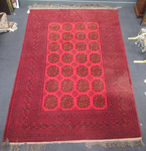 Lot 555 - A large Afghan carpet, 380 x 250cm