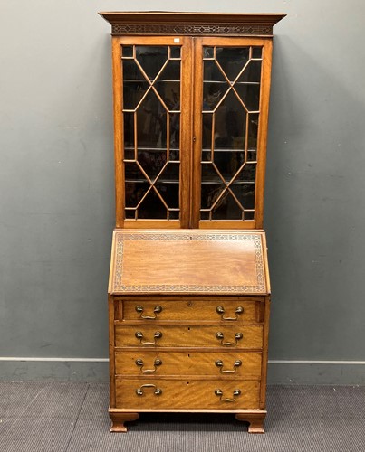 Lot 517 - A mahogany glazed top bureau bookcase, with...