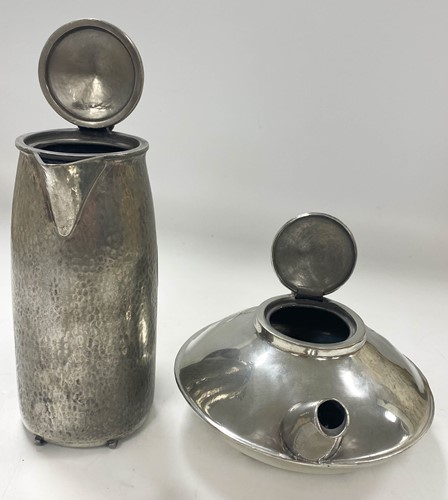 Lot 122 - Archibald Knox (1864-1933) for Liberty & Co., an Arts & Crafts Tudric polished pewter teapot